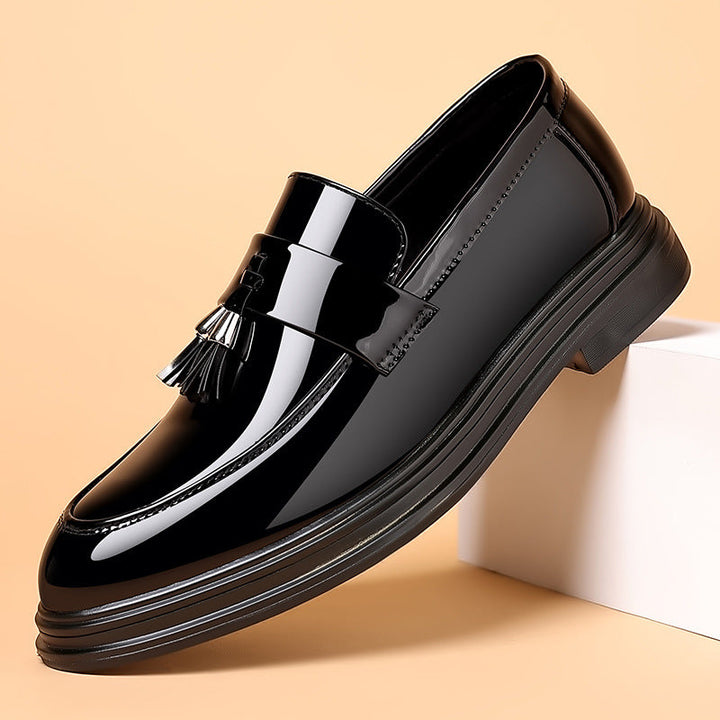 Luxurious men's polished leather tassel loafers. Comfortable slip-on dress shoes suitable for formal and smart casual events.
