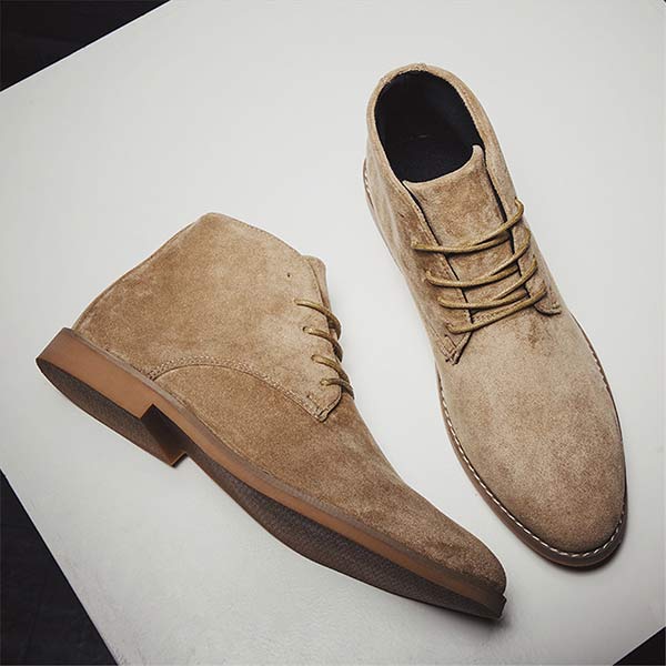 Stylish men's ankle boots with cushioned support, great for fall and winter fashion.