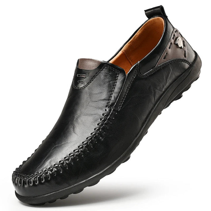 Stylish men's black leather loafers with a sleek design. Premium slip-on shoes for casual or dressy occasions.