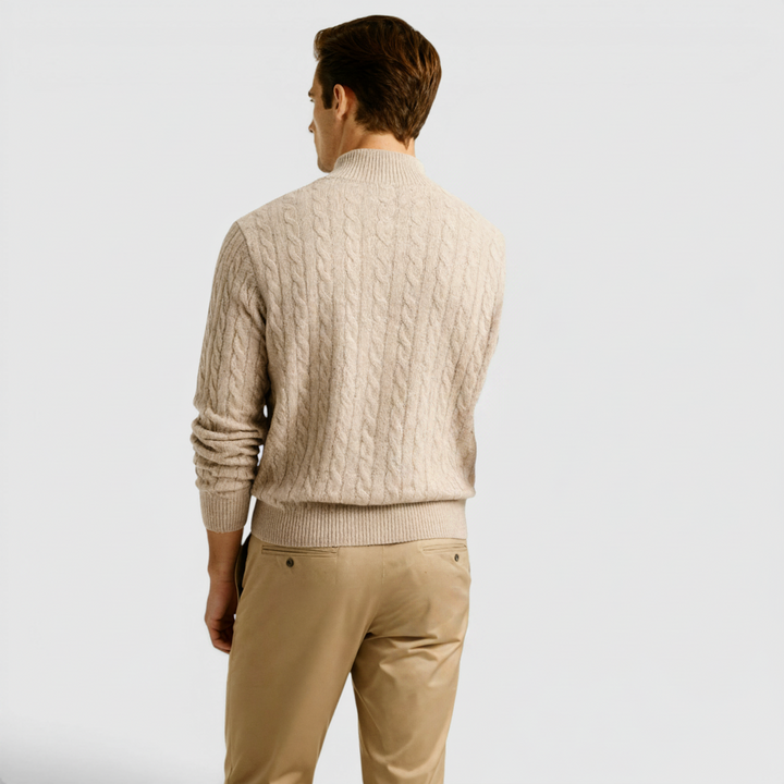 Man in a meeting wearing a versatile half-zip sweater, suitable for modern business casual.