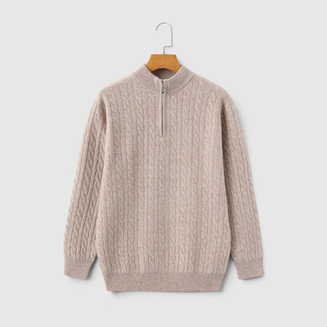 Neatly folded men's premium half-zip knit sweater, showing its rich texture & quality.