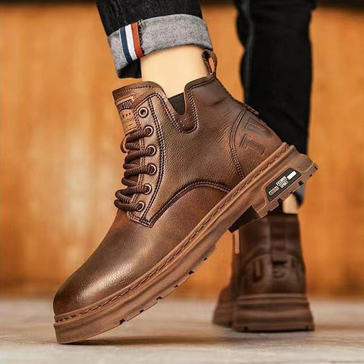 Heel of men's premium slip-on work boots, robust anti-slip design for secure work & casual wear.