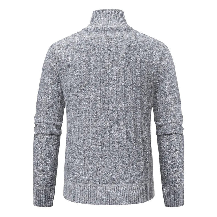 Soft textured cable knit men's quarter zip sweater in a deep green, providing cozy warmth and modern style.