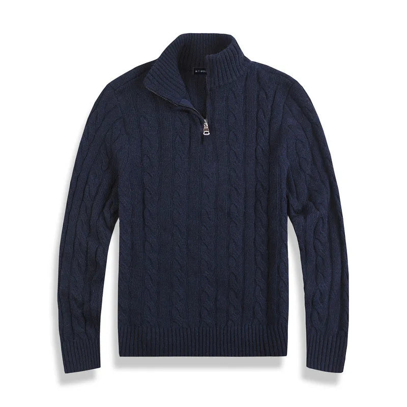 Detail of men's cable knit texture on a quarter-zip sweater, showcasing craftsmanship.