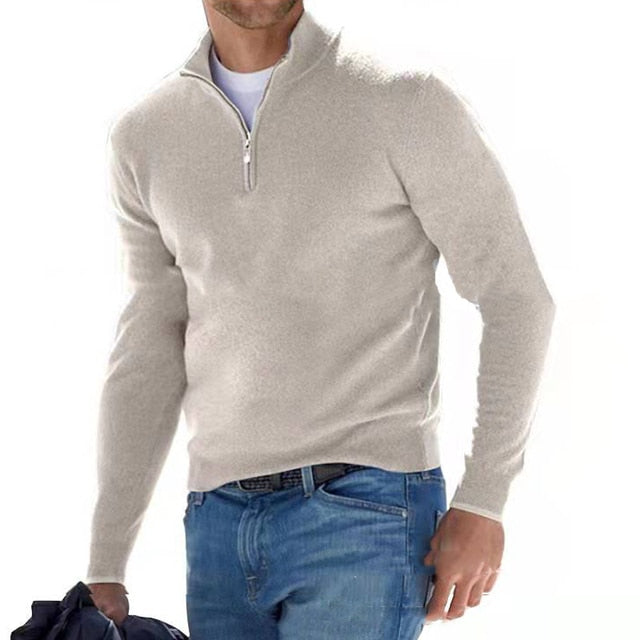 Close-up of men's quarter zip sweater, showcasing the stand collar, soft fabric, and ribbed cuffs.