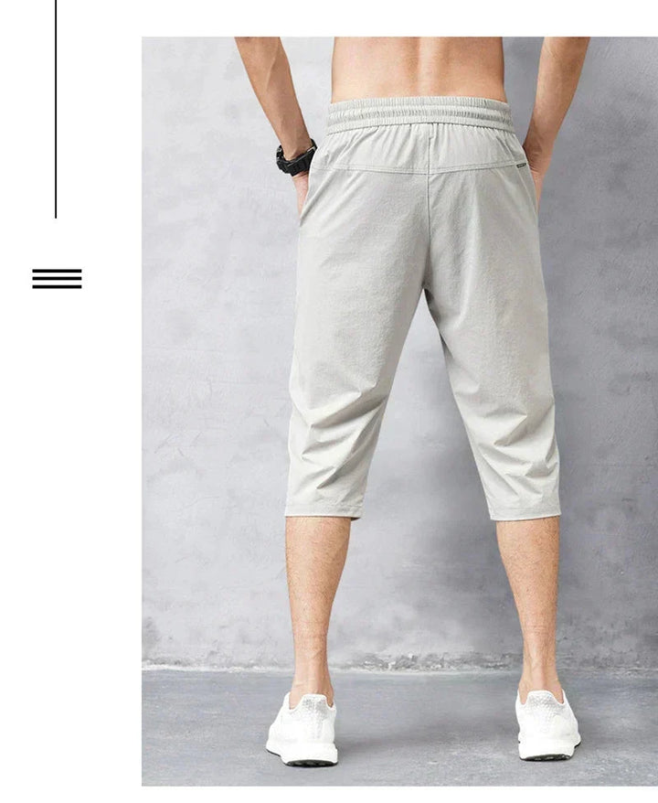Comfortable men's quick-dry long swim shorts in a relaxed fit, ideal for summer beachwear and swimming.