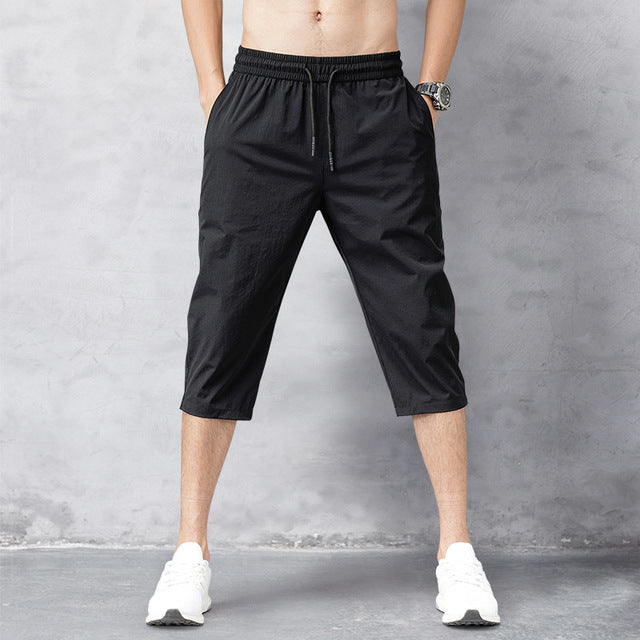 Men's quick-dry long swim shorts designed for ultimate comfort at the beach or pool. Essential summer swimwear.
