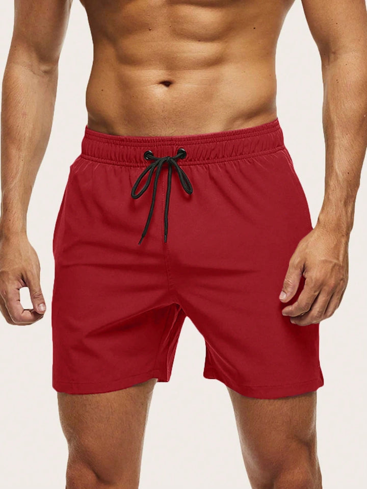 Men's quick-dry stretch swim shorts in blue for beach & pool. Lightweight & comfortable athletic swimwear.