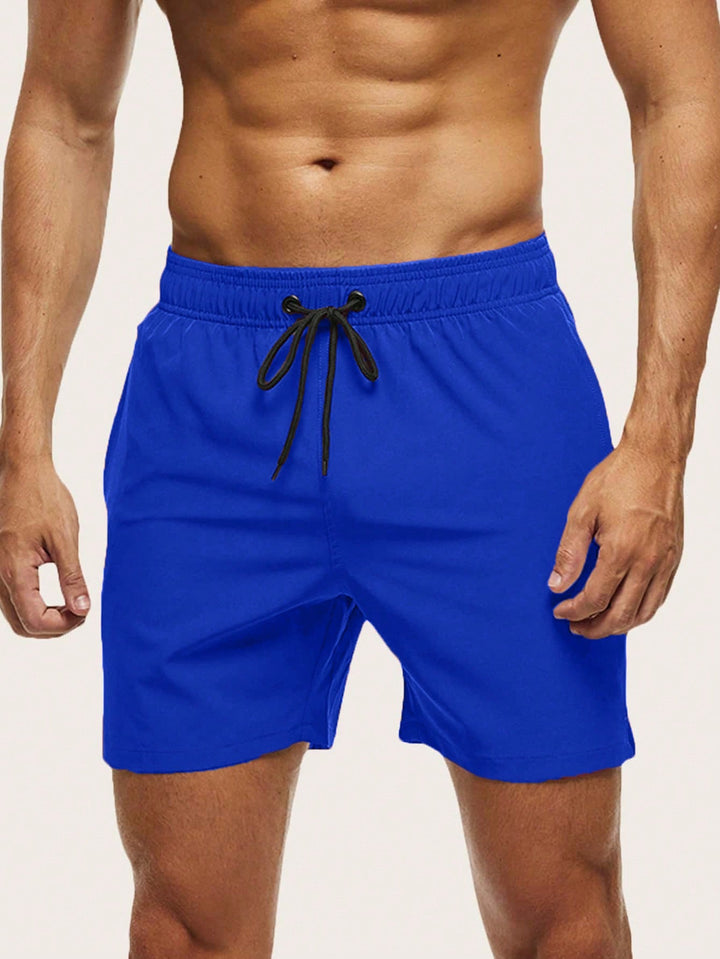 Black men's quick-dry stretch swim shorts for ultimate comfort & beach style. Perfect holiday wear.