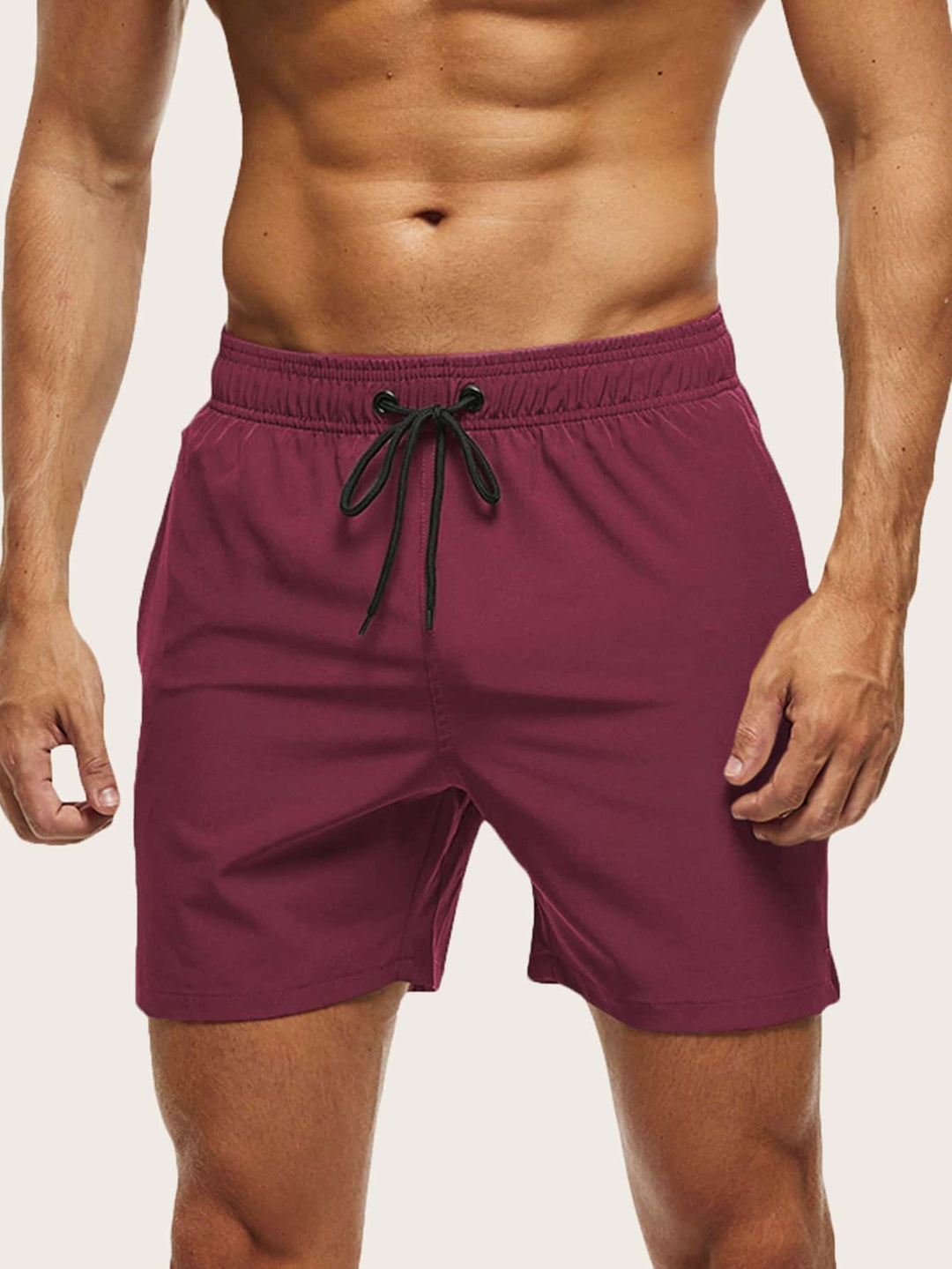 Athletic men's swim shorts, quick-dry fabric & flexible stretch. Essential beachwear for men.