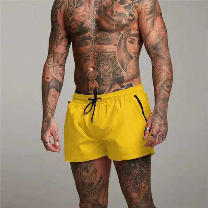 Active men's quick-dry stretch swim shorts with pockets for swimming, beach, or summer sports.