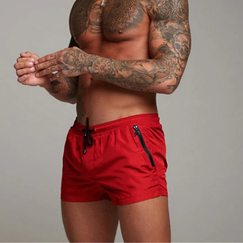 Front view of men's quick-dry stretch swim shorts with functional pockets, suitable for swimming.
