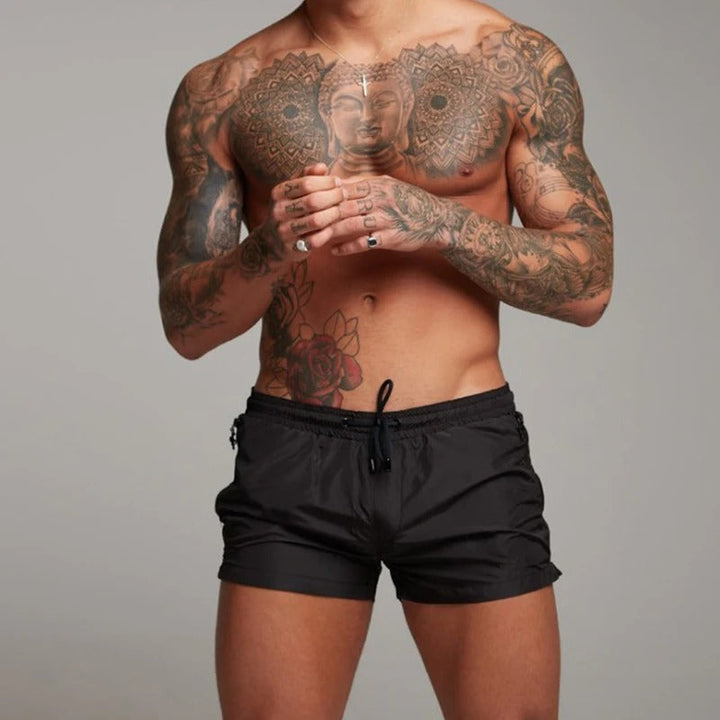 Stylish men's quick-dry stretch swim shorts with pockets, versatile for summer beachwear.