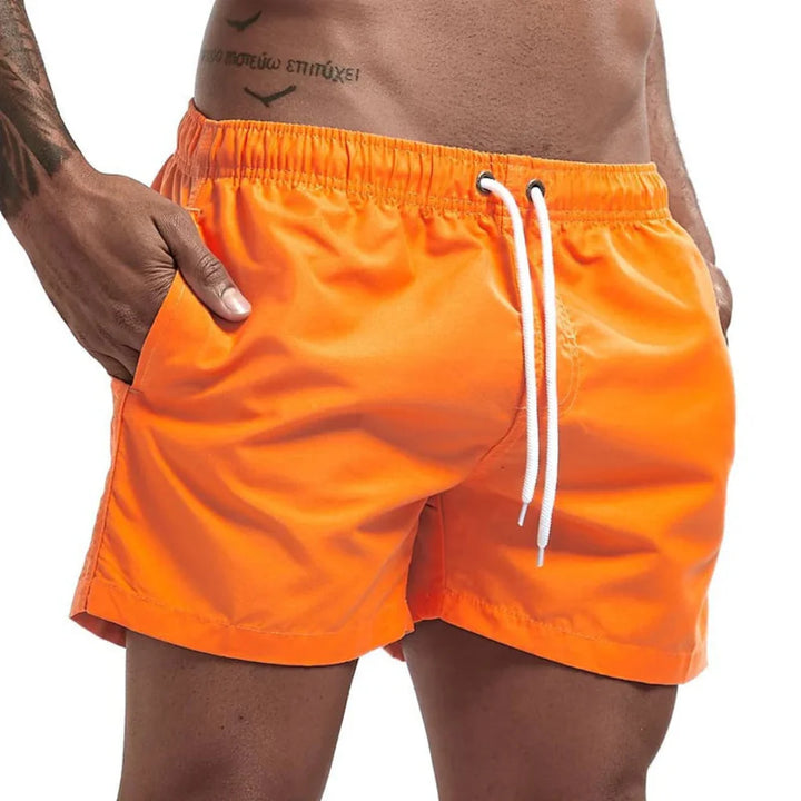 Modern design men's quick-dry swim shorts, offering comfort for beach & pool.