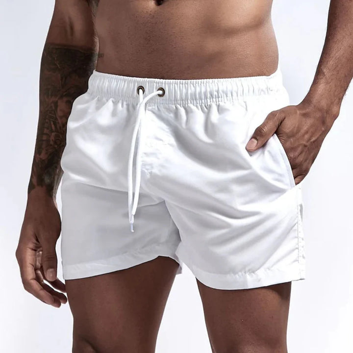 Comfortable men's quick-drying swim shorts, ideal for beach and summer.