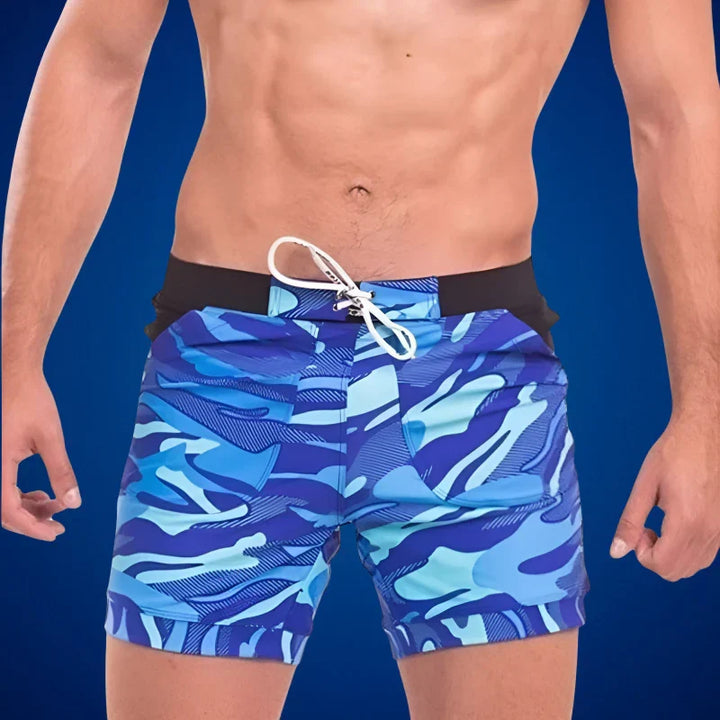 Stylish men's quick-dry beach shorts with elastic waist, ideal for swimming & summer activewear. Casual & comfortable.