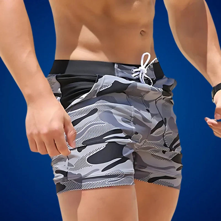 Lightweight men's summer swim shorts, quick-drying fabric for beachwear, vacation, or casual poolside style.