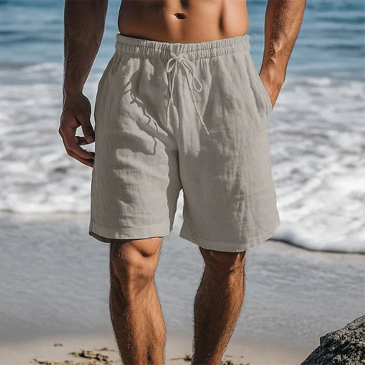 Model wearing men's athletic swim shorts for water sports and beach activities.