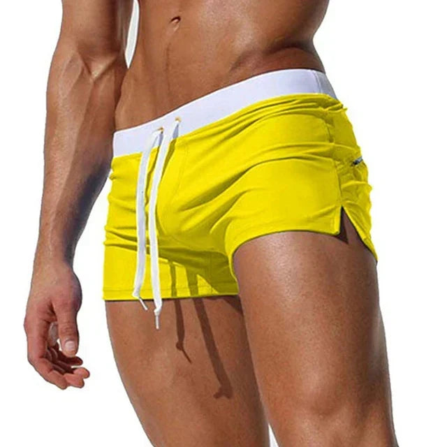 Men's quick-dry board shorts with adjustable waist, essential summer beachwear for men.