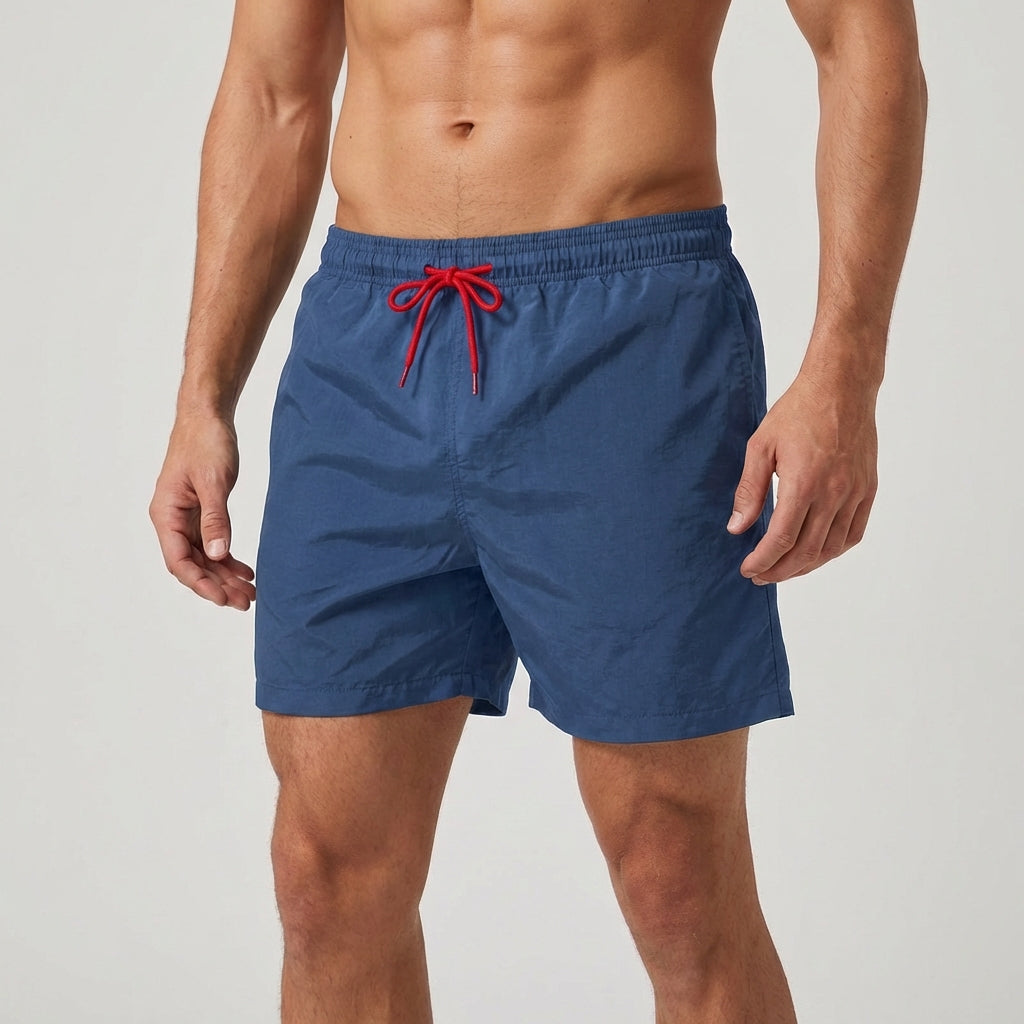 Performance men's quick-dry beach shorts, elastic waist, essential for summer recreation.