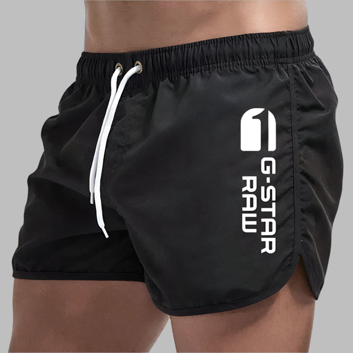 Close-up of men's quick dry swim trunks fabric, showcasing lightweight design.