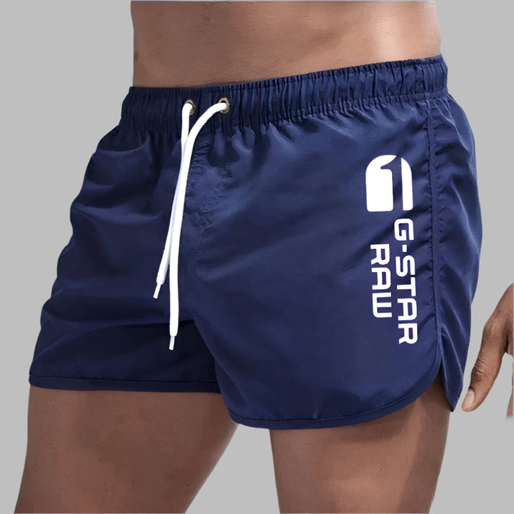 Athletic men's quick dry swim trunks, ideal for swimming and beach activities.