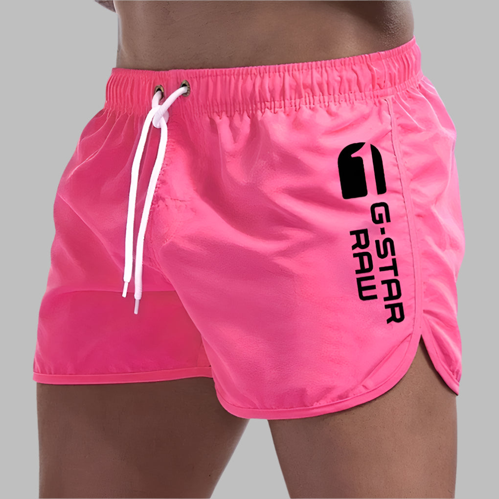 Casual men's swim trunks with quick dry technology, essential summer beachwear.
