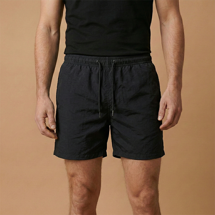 Breathable men's summer shorts with drawstring closure, excellent for outdoor activities.