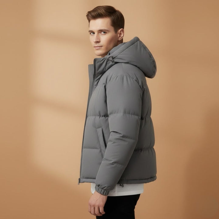 Front view of a men's down jacket with a functional zip closure and attached hood.