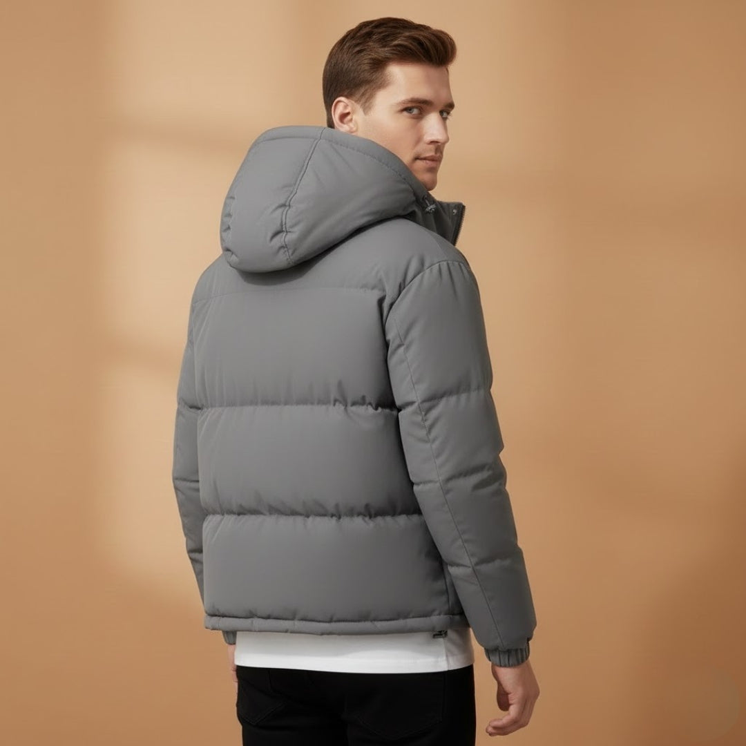 Durable men's outerwear: a quilted, hooded jacket designed for cold weather.