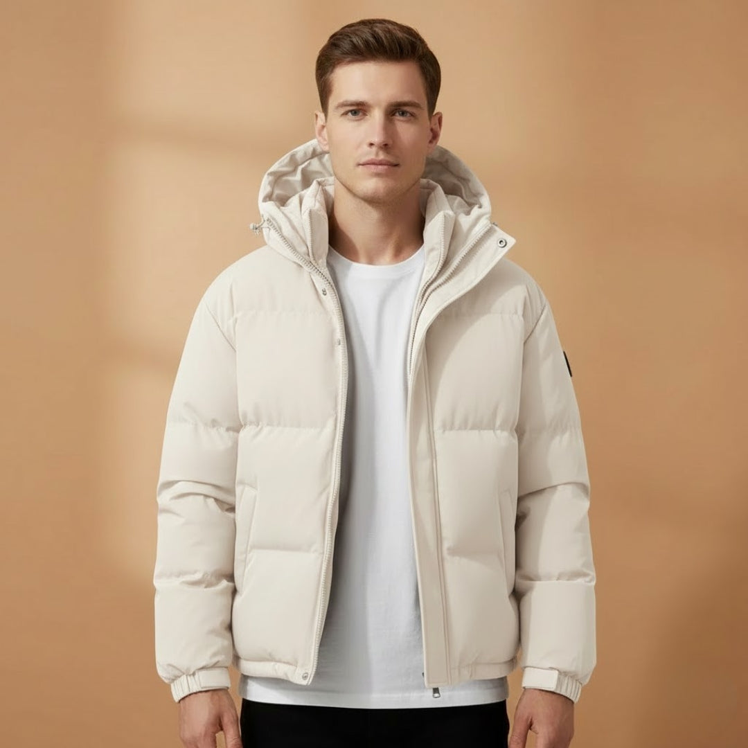 Model wearing a men's casual jacket, showcasing the quilted texture and hood.