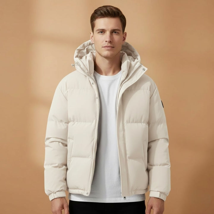 Model wearing a men's casual jacket, showcasing the quilted texture and hood.