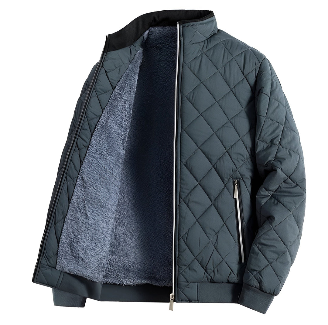 Man wearing a warm, casual quilted jacket with zippered pockets in a spring setting.