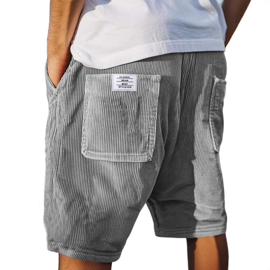 Men's refined textured tailored shorts in blue for sophisticated casual summer style.