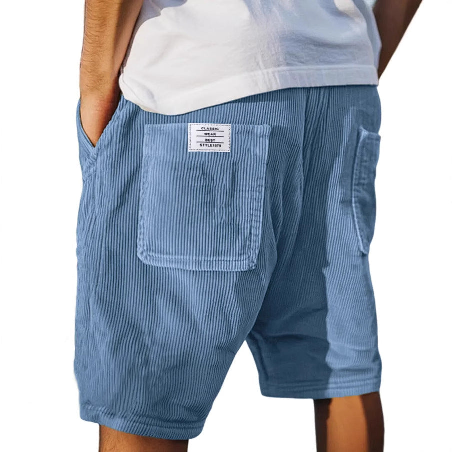 Stylish men's tailored shorts, subtly textured, perfect for effortless men's fashion and summer outfits.