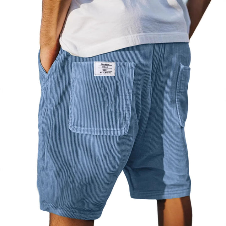 Stylish men's tailored shorts, subtly textured, perfect for effortless men's fashion and summer outfits.