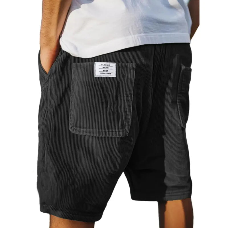 Close-up of men's textured tailored shorts fabric, highlighting the quality and comfortable summer design.