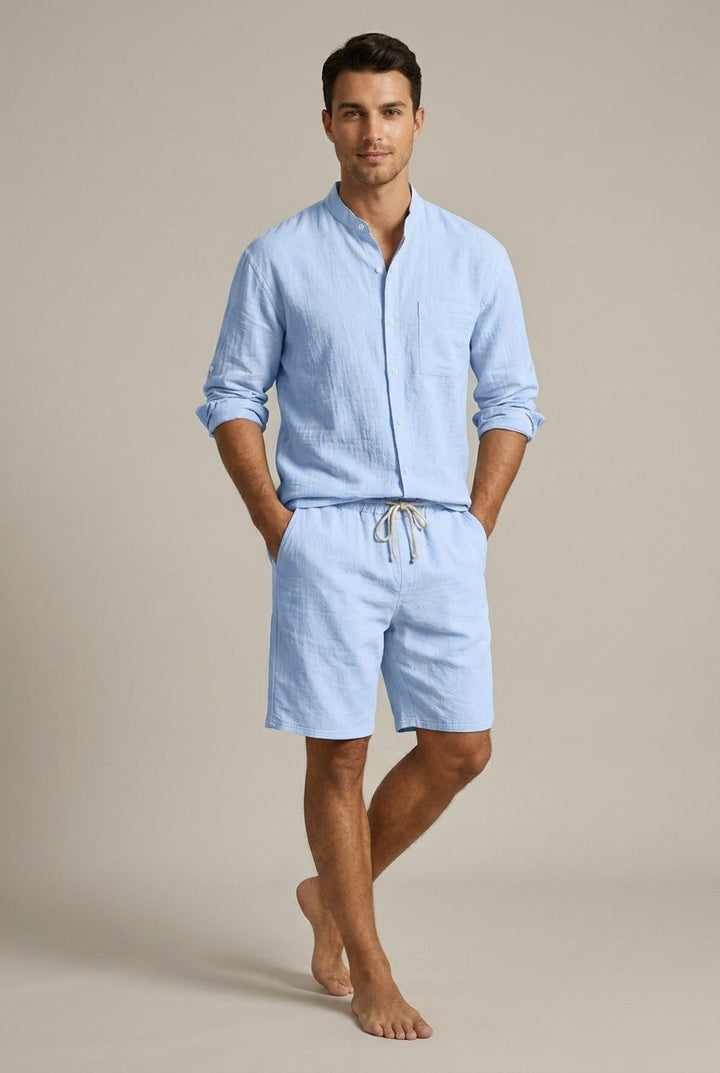 Men's casual apparel set with a relaxed band collar shirt and comfortable summer shorts, perfect for holidays.