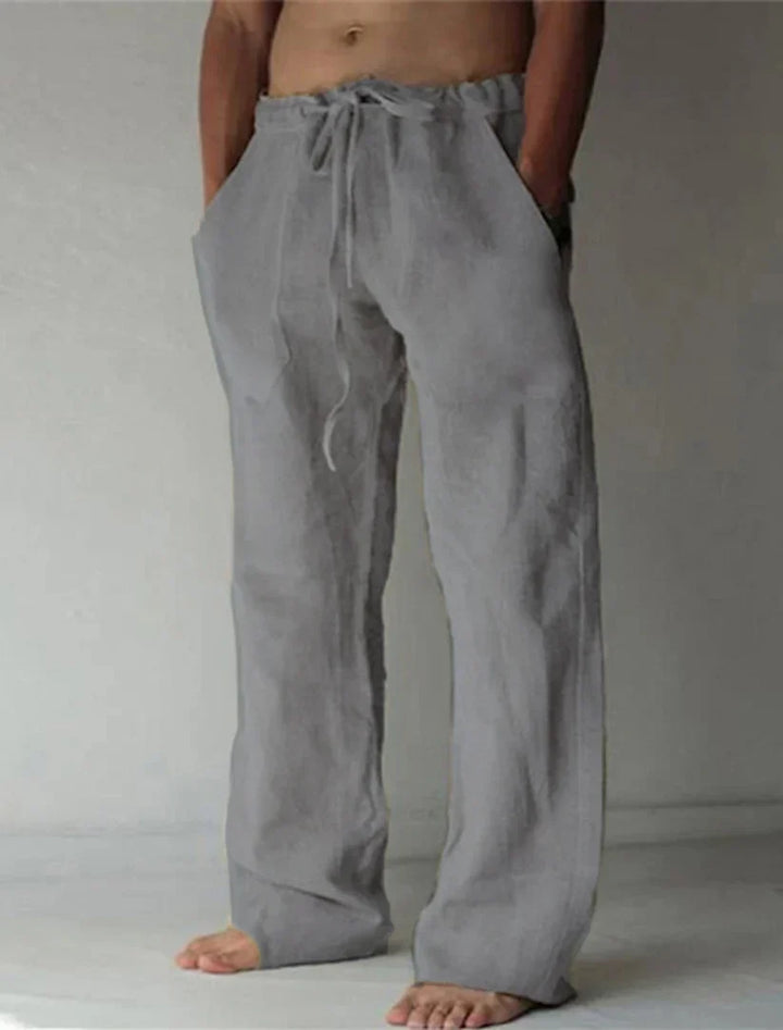 Back view of men's comfortable relaxed fit baggy pants. Loose fit casual bottoms with ample pockets.