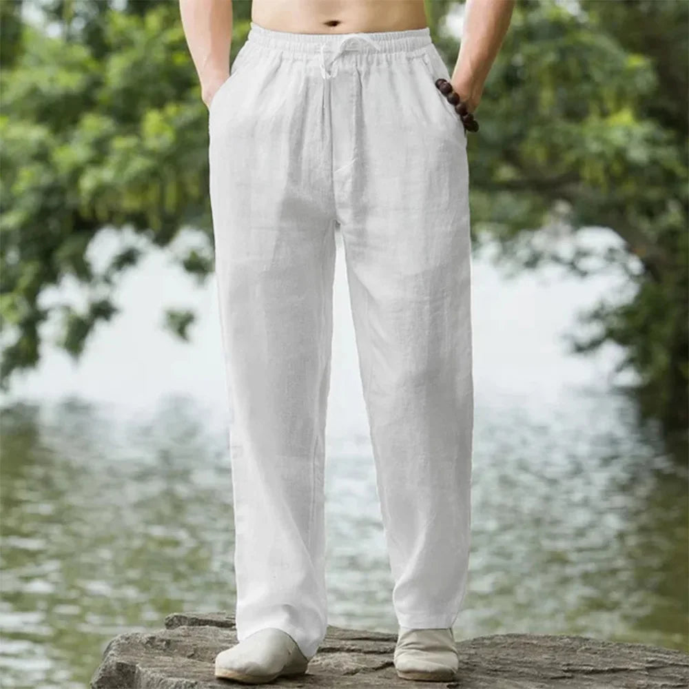 Men's relaxed fit beach pants with drawstring waist for comfortable, lightweight summer wear.