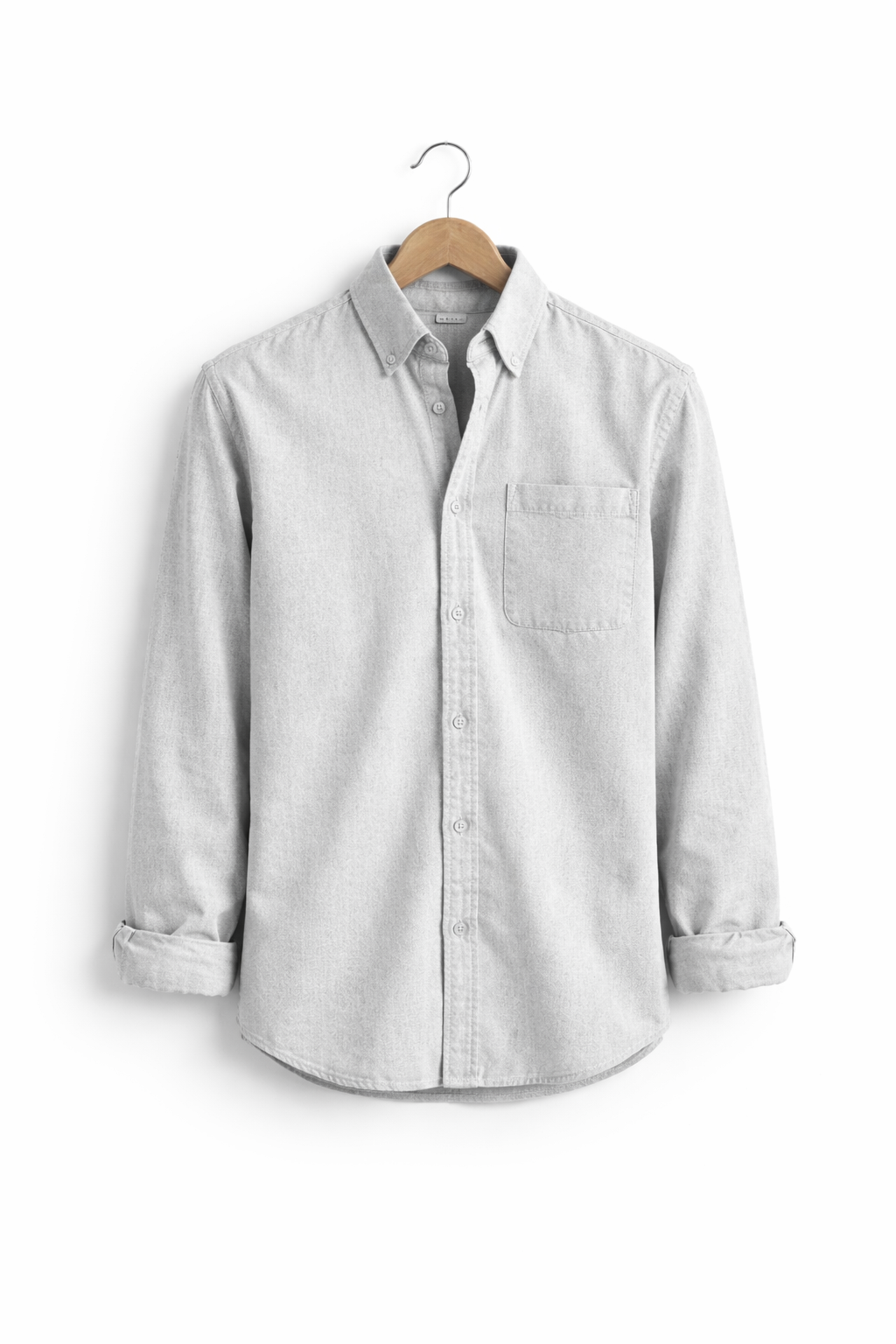 Model wearing a men's relaxed fit button-front long sleeve shirt, showcasing casual comfort.