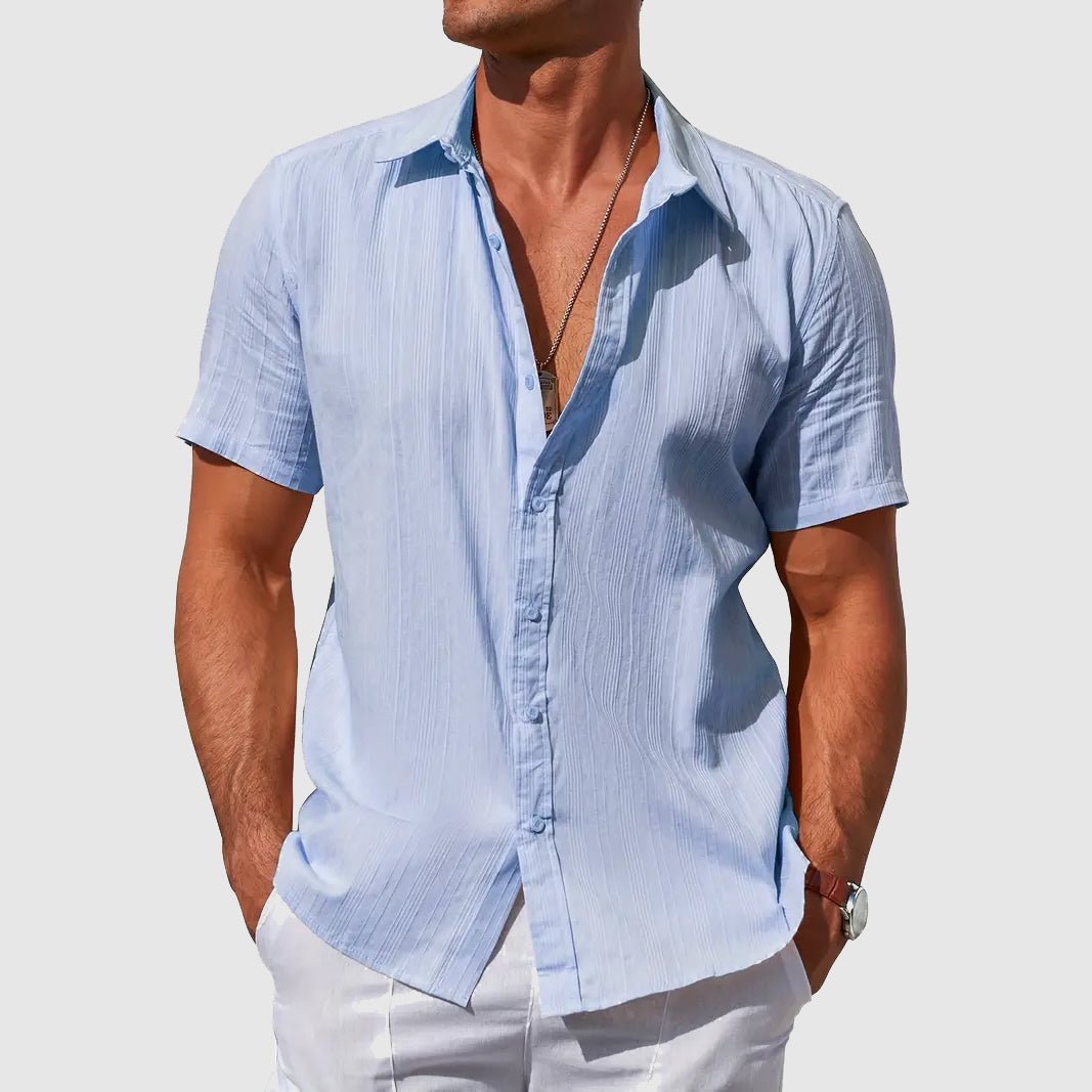 Men's relaxed fit button-front short sleeve shirt, perfect for casual summer days and warm weather comfort.
