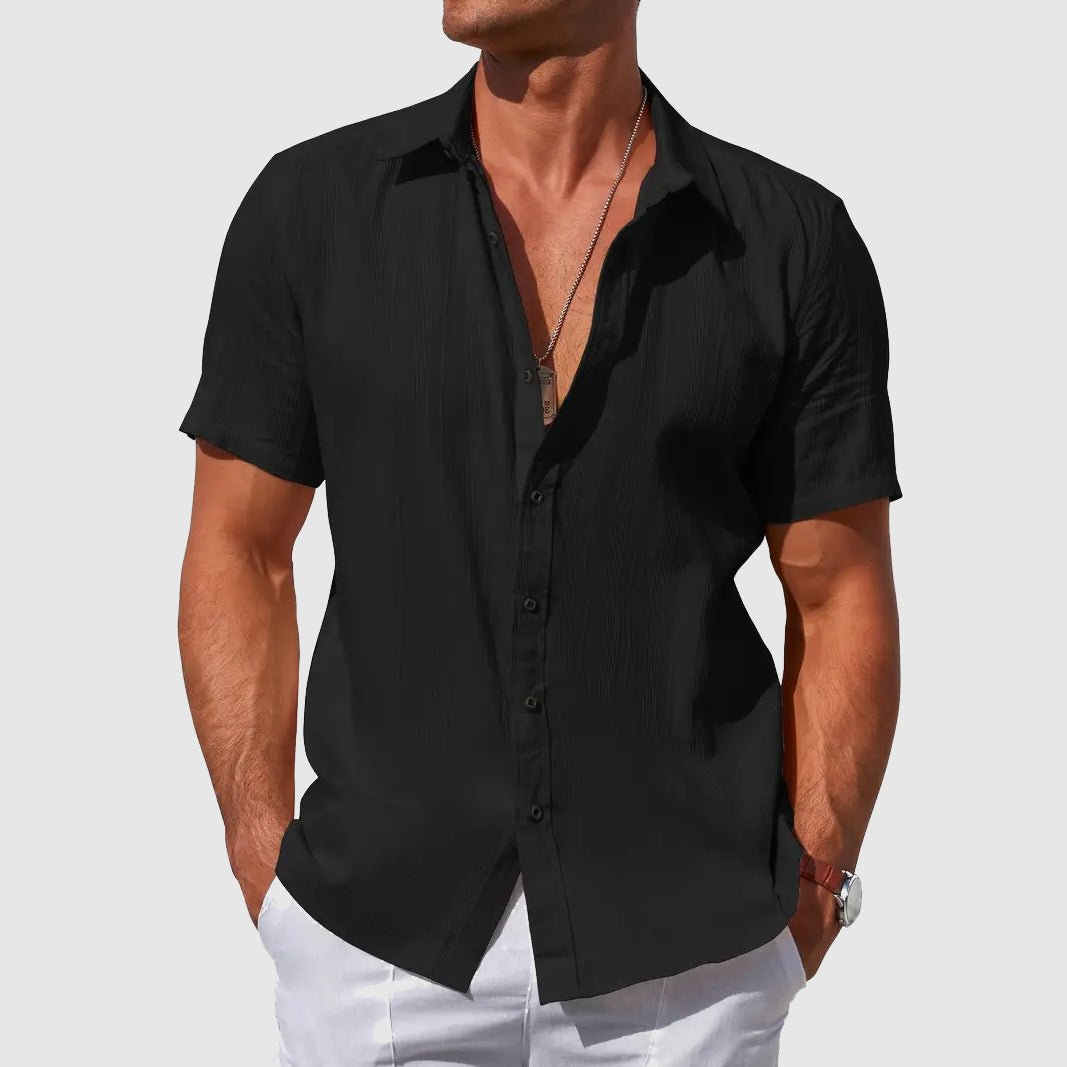 Versatile men's short sleeve button-front top, featuring a relaxed summer fit for ultimate warm-weather comfort.