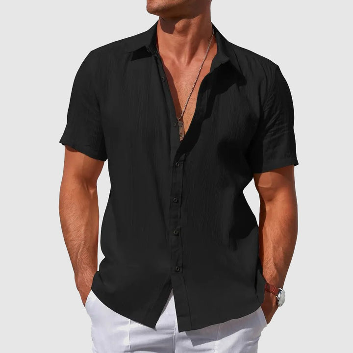 Versatile men's short sleeve button-front top, featuring a relaxed summer fit for ultimate warm-weather comfort.