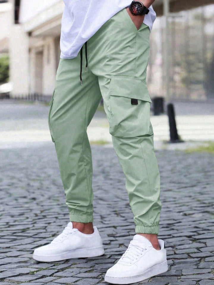Men's cargo jogger pants in relaxed fit, perfect for spring/summer fashion. Comfortable streetwear style for men.