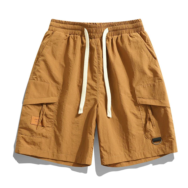Men's relaxed fit cargo shorts with an elastic waist, perfect for casual summer wear & utility.
