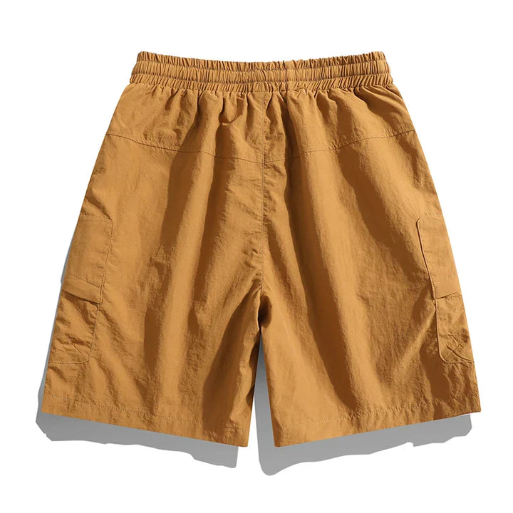 Versatile men's relaxed fit cargo shorts with elastic waist, great for summer adventures & casual outings.