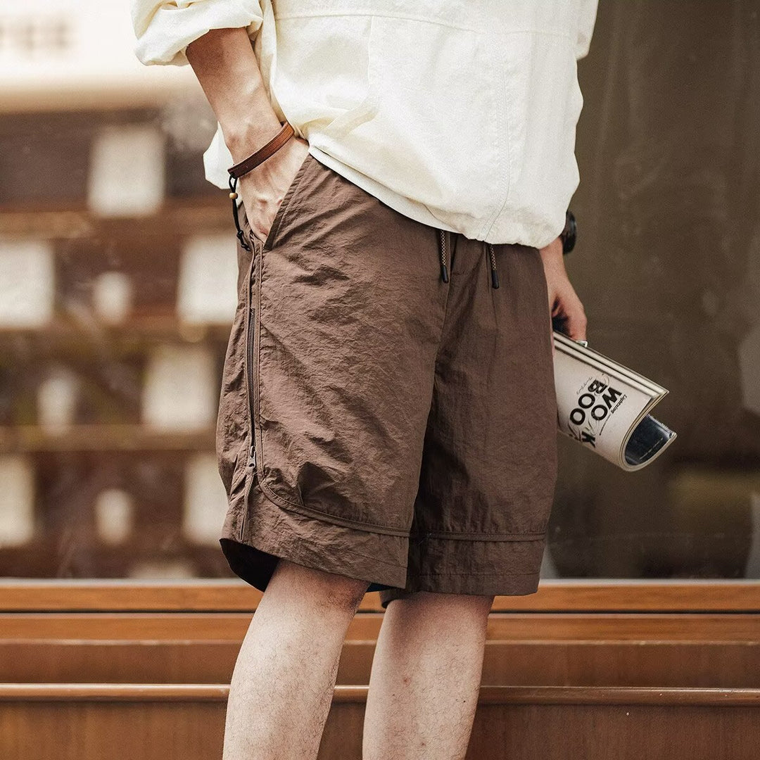 Men's relaxed fit cargo shorts with drawstring waist, knee-length, perfect for casual summer wear.