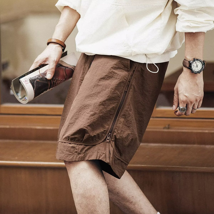 Stylish men's utility cargo shorts, relaxed fit, knee-length, featuring a comfortable drawstring waist.