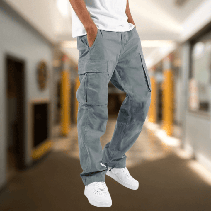 Khaki men's relaxed fit cargo trousers with multiple pockets, ideal for utility and casual fashion.